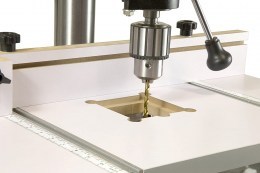 Drilling table with adjustable stop and stop block